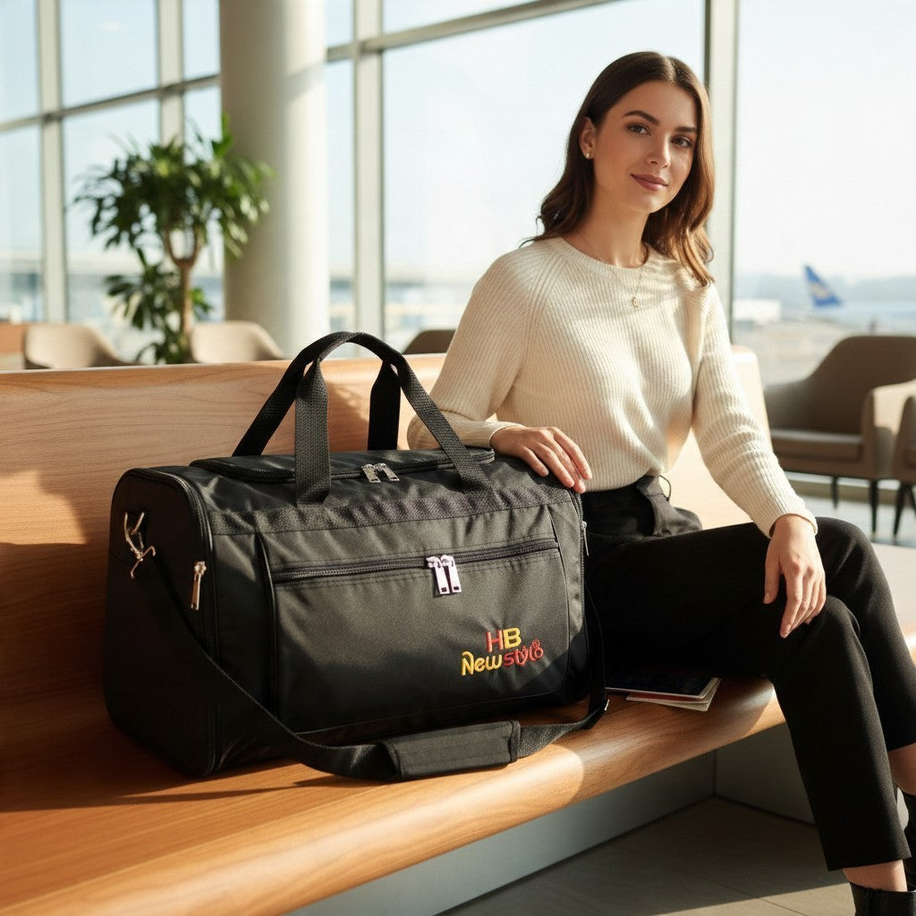 Fixed Price Shop black parachute material duffle bag with expandable side zips, held by a woman in an airport lounge.