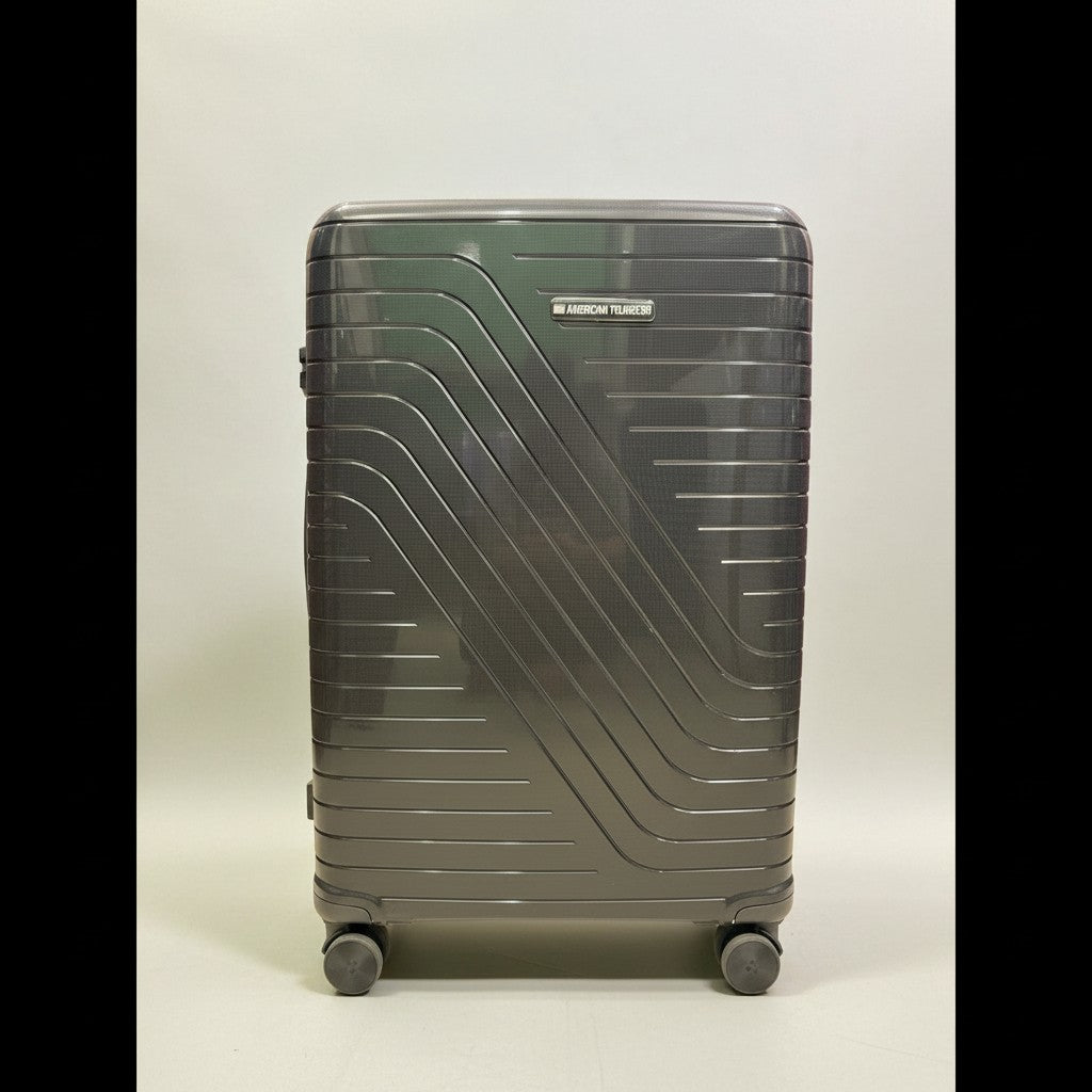 Fixed Price Shop American Tourister charcoal grey hardshell luggage with TSA lock and expandable zipper.