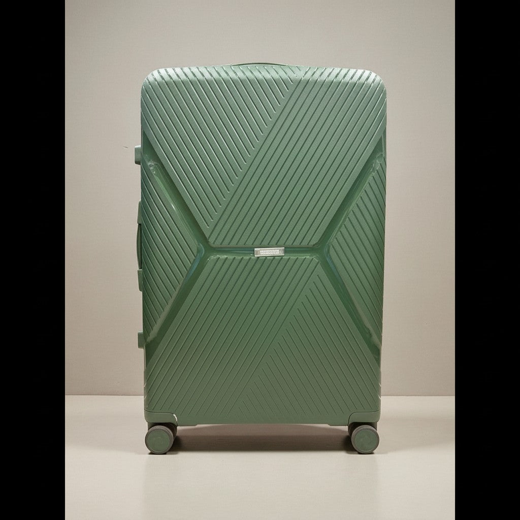 American Tourister green PP luggage with expandable zipper and TSA-approved lock. Features 360-degree wheels and a geometric pattern.