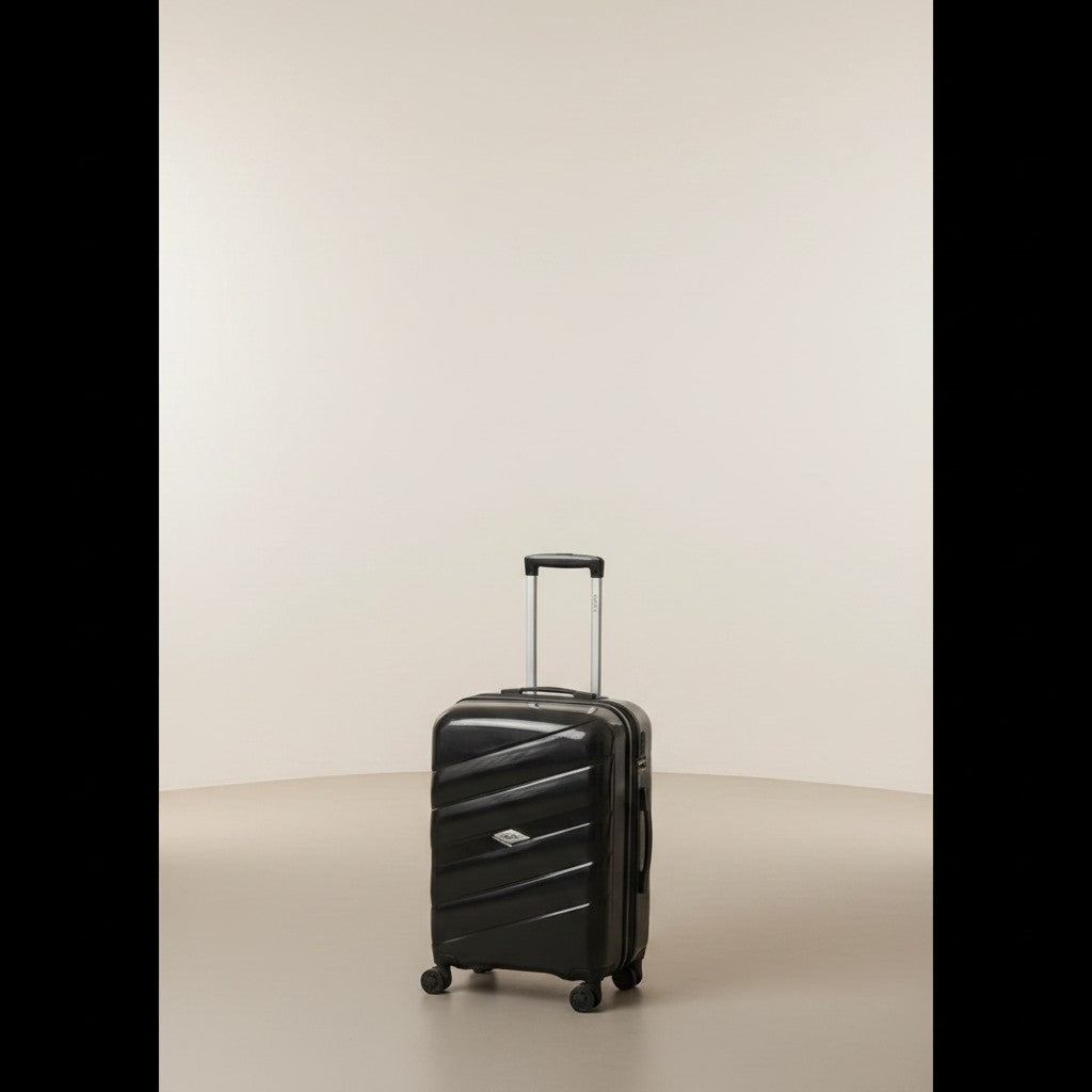 Fixed Price Shop black expandable pp luggage with TSA lock and anti-theft zipper, held by a man in a bedroom.