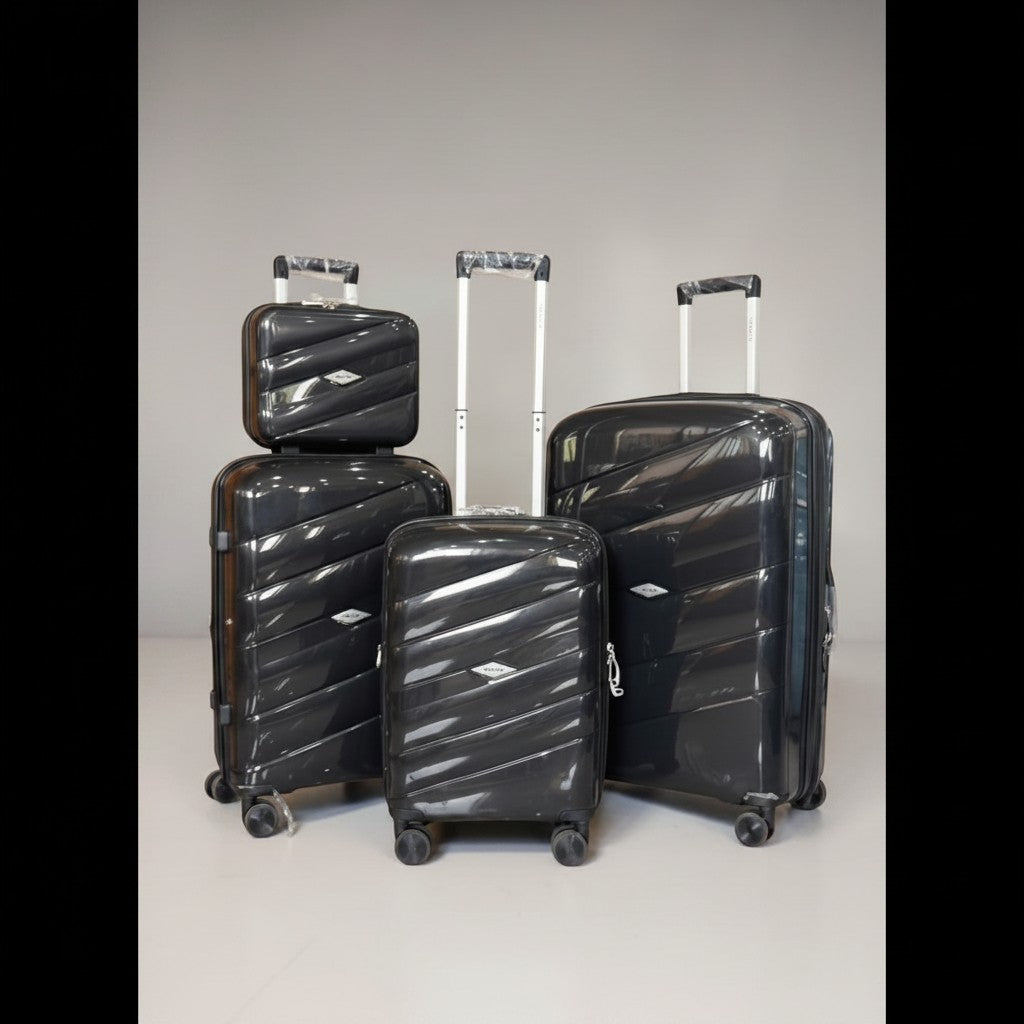 Fixed Price Shop black 4-piece polypropylene luggage set with TSA lock and expandable zippers.